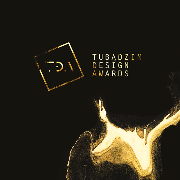Złote logo "TDA" i napis "TUBĄDZIN DESIGN AWARDS" na czarnym tle. Kontekst: wydarzenie branżowe.