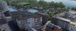 Wizualizacja architektoniczna nowoczesnego osiedla nad rzeką. Widoczne budynki mieszkalne, tereny zielone i most.